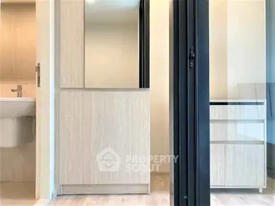 Modern bathroom with sleek cabinetry and neutral tones, perfect for a contemporary home.
