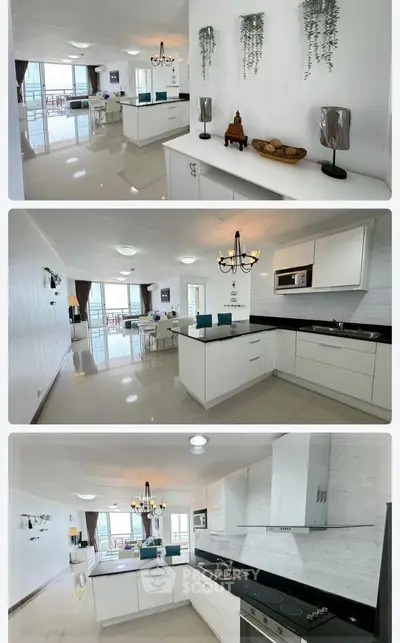 Spacious modern kitchen with sleek design and open layout, featuring elegant lighting and ample natural light.