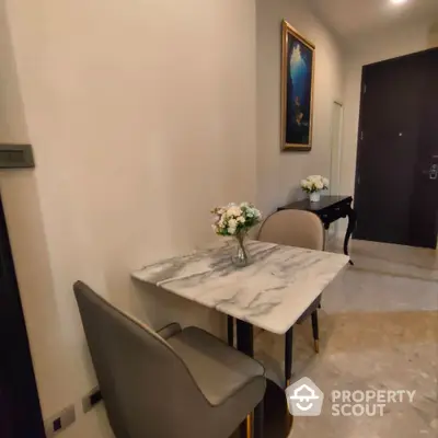 Elegant dining nook with marble table and chic chairs in modern apartment