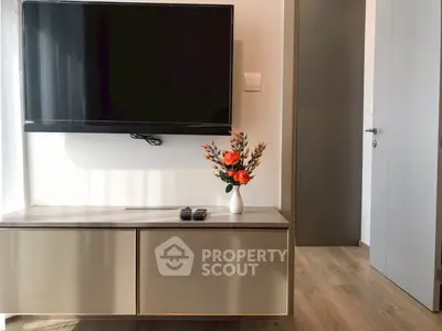 Modern living room with wall-mounted TV and elegant decor