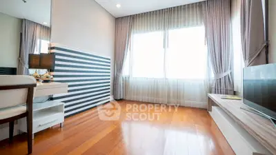 Bright modern living room with wooden floors and stylish decor