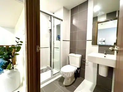 Modern bathroom with sleek design and glass shower enclosure