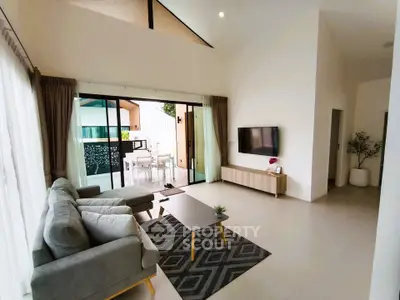 Spacious modern living room with large windows and stylish decor
