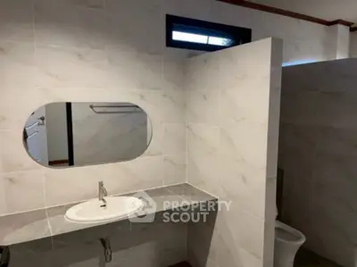 Modern bathroom with sleek sink and tiled walls