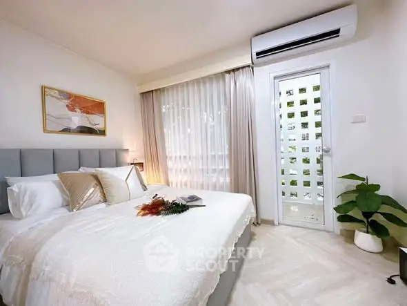 Elegant bedroom with modern decor and natural light