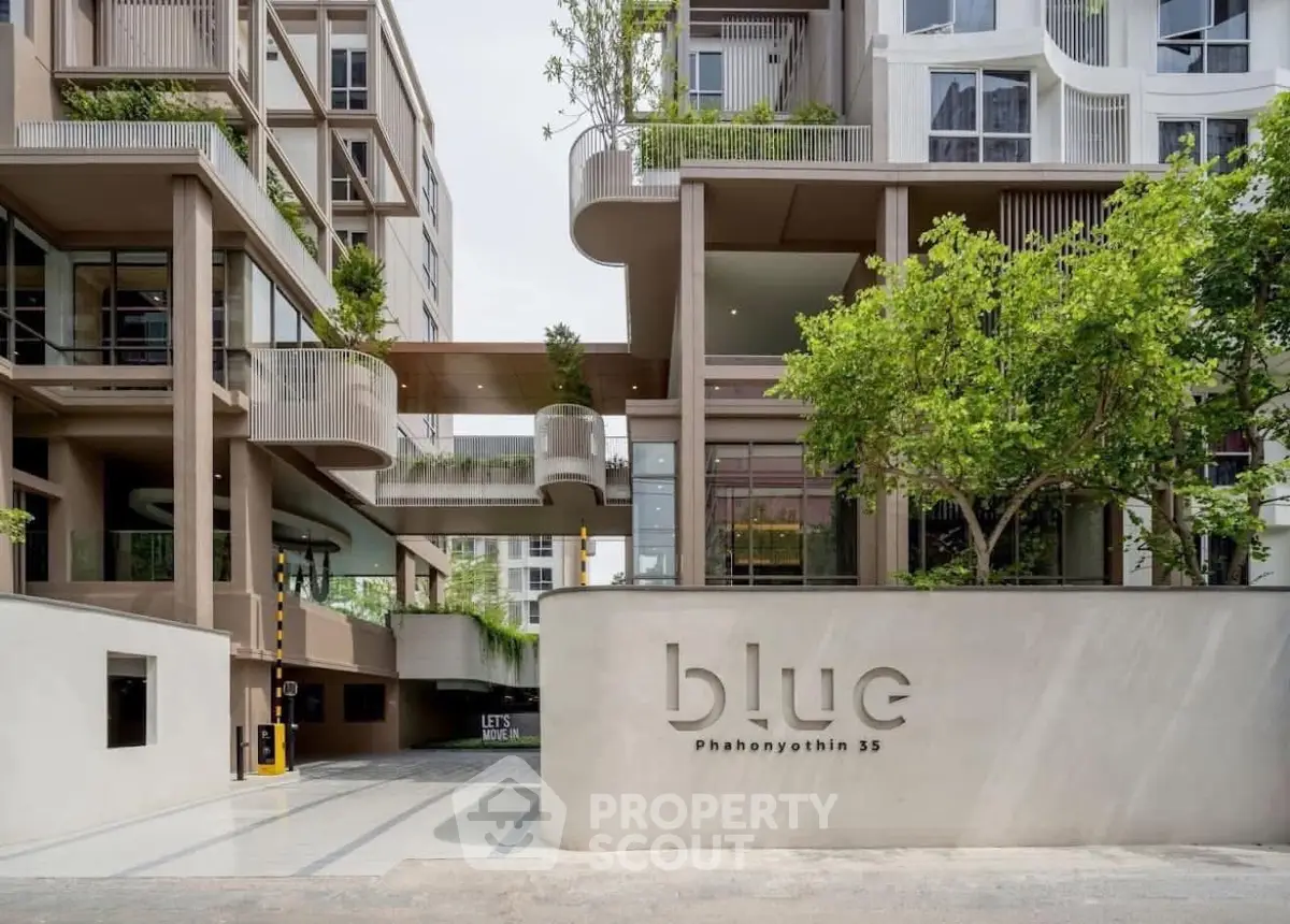 Modern architectural building with lush greenery and stylish design at Blue Phahonyothin 35.