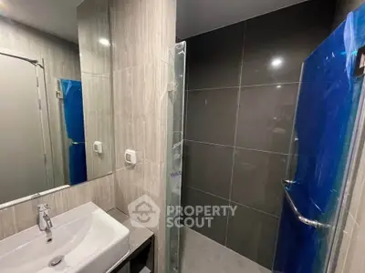 Modern bathroom with sleek design and glass shower enclosure