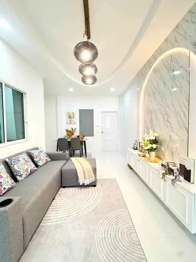 Modern living room with stylish decor and elegant lighting in a contemporary home.