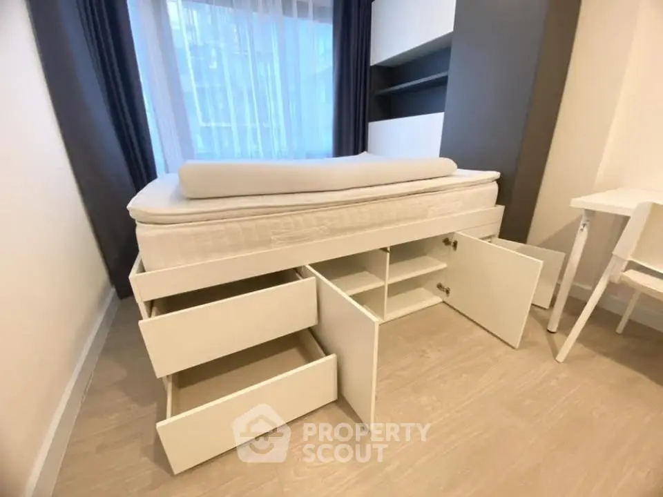 Modern bedroom with storage bed and sleek design, perfect for maximizing space in urban living.