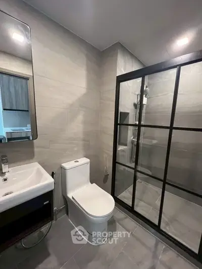 Modern bathroom with sleek shower enclosure and contemporary fixtures