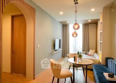 Modern living room with stylish decor, cozy seating, and elegant lighting in a contemporary apartment.