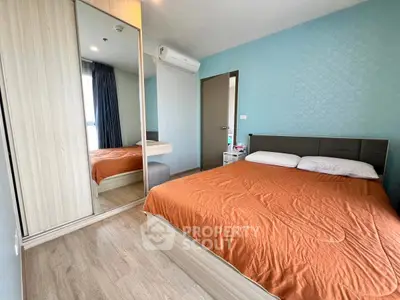 Cozy bedroom with mirrored wardrobe and modern decor