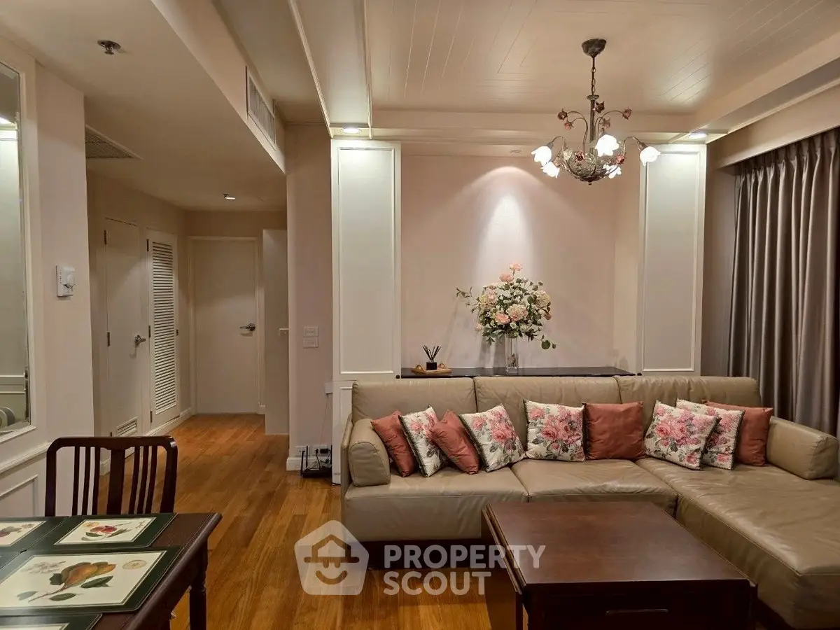 Elegant living room with floral decor and cozy seating in modern apartment