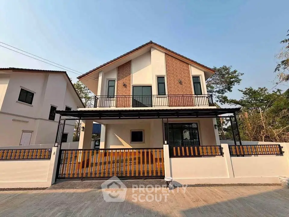 Charming two-story house with modern design and spacious balcony in a serene neighborhood.