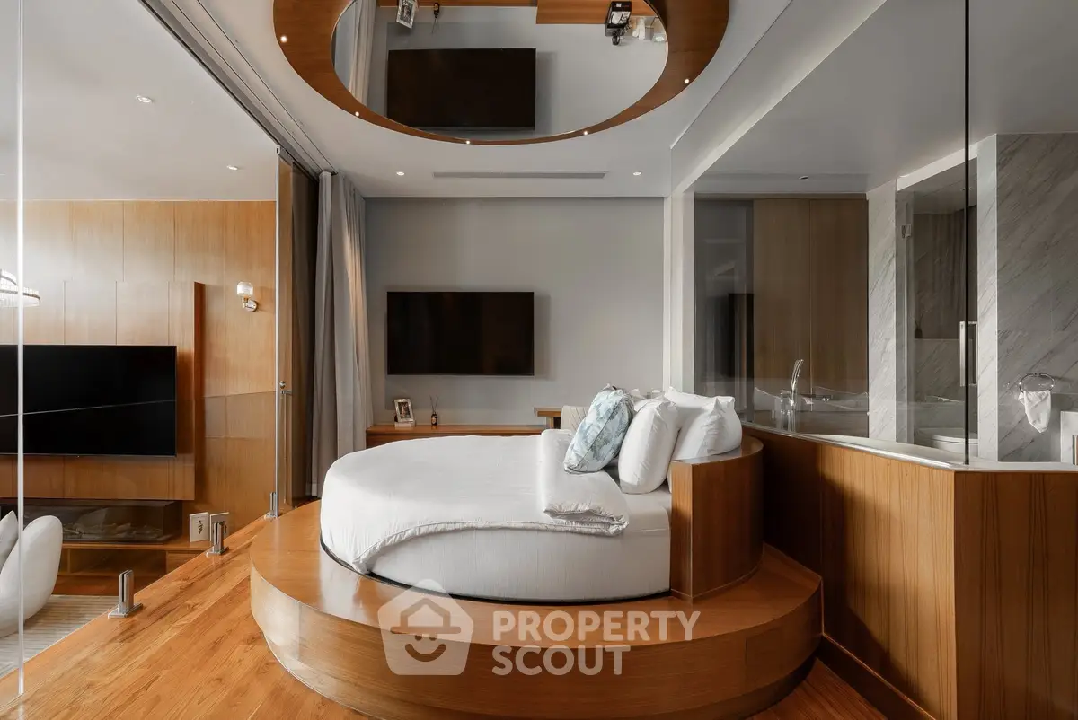 Luxurious modern bedroom with round bed and elegant wooden accents