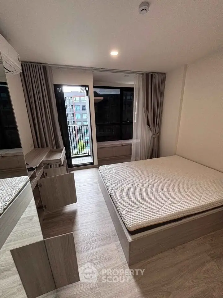 Modern bedroom with balcony view in urban apartment