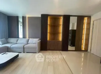 Spacious modern living room with elegant lighting and stylish furniture