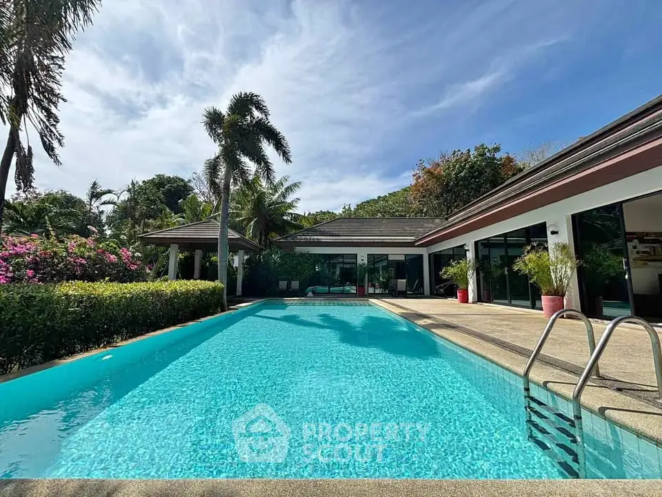 Luxurious villa with private pool and lush garden, perfect for tropical living.