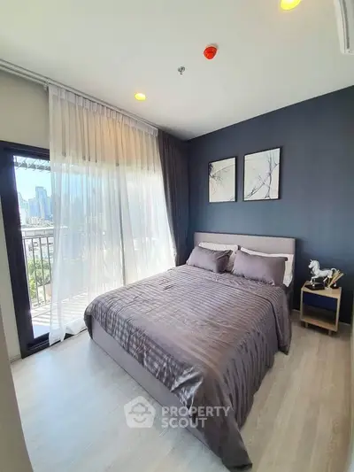 Modern bedroom with city view and elegant decor in high-rise apartment