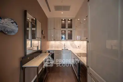 Luxurious modern kitchen with sleek cabinetry and integrated appliances