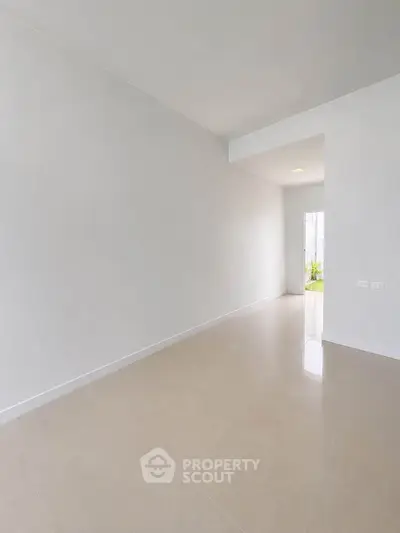 Spacious minimalist hallway with natural light and modern design