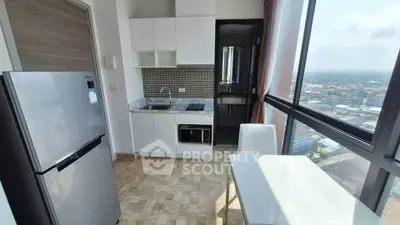Modern kitchen with panoramic city view, featuring sleek appliances and stylish cabinetry.