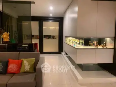 Modern living room with sleek cabinetry and ambient lighting