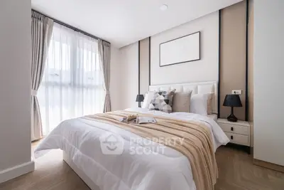 Elegant bedroom with cozy decor and natural light, perfect for relaxation.