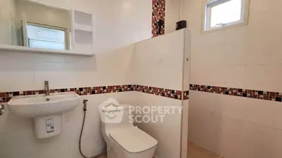 Modern bathroom with sleek design and stylish tile accents