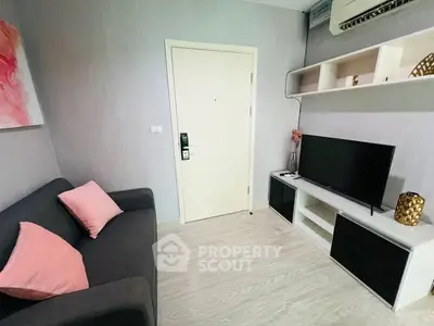 Cozy living room with modern decor and wall-mounted TV