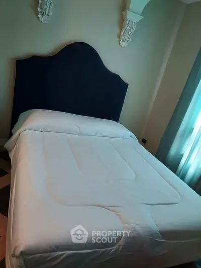 Cozy bedroom with elegant headboard and soft lighting