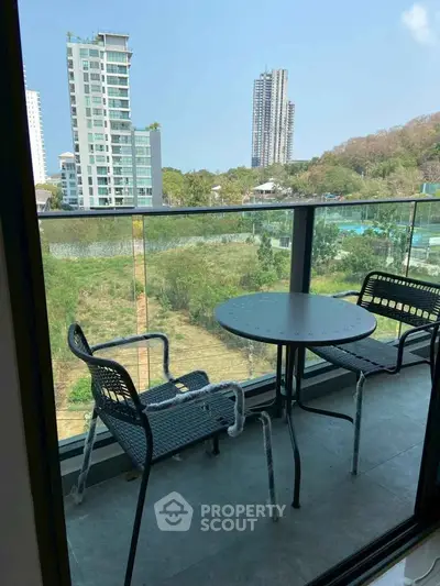 Charming balcony with modern seating and stunning city view