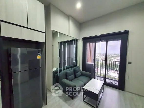 Modern living room with balcony view in high-rise apartment