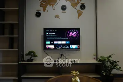 Modern living room with wall-mounted TV and stylish decor