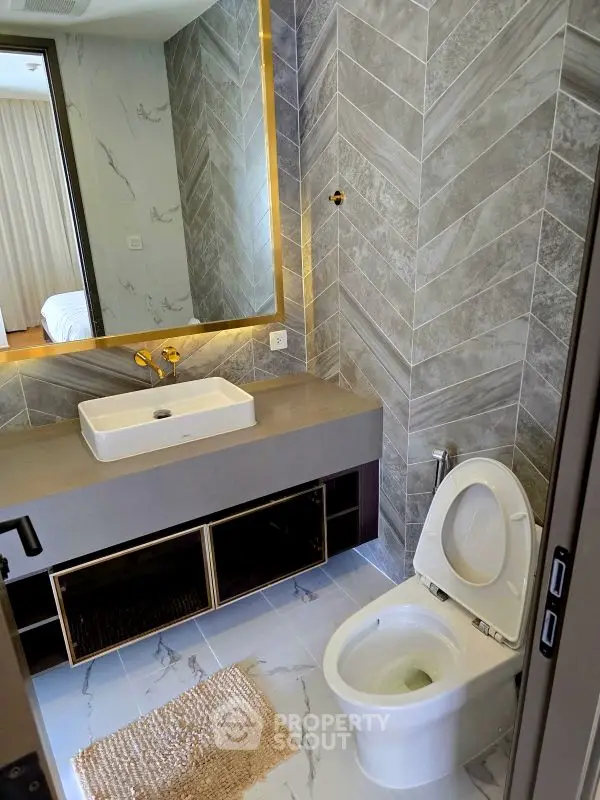 Modern bathroom with elegant marble tiles and stylish fixtures