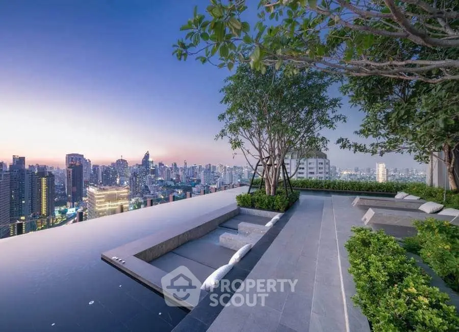 Stunning rooftop view with infinity pool overlooking city skyline at dusk.