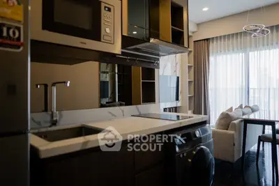 Modern kitchen with sleek appliances and open layout in stylish apartment
