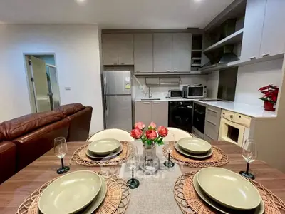 Modern kitchen and dining area with stylish decor and appliances