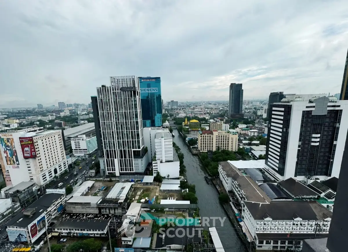 Stunning cityscape view showcasing modern high-rise buildings and a serene canal.