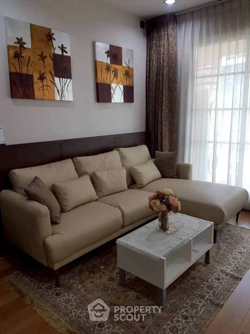 Cozy living room with elegant decor and comfortable beige sofa