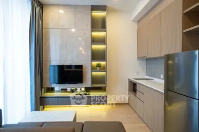 Modern living room with sleek design and integrated kitchen appliances
