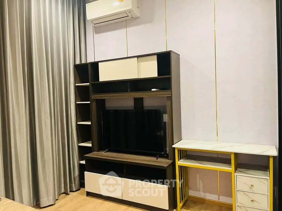 Modern living room with stylish TV unit and air conditioning