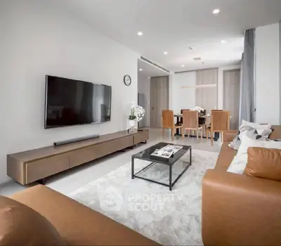 Modern living room with sleek furniture and open dining area, perfect for stylish urban living.