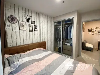 Cozy bedroom with stylish decor and spacious walk-in closet