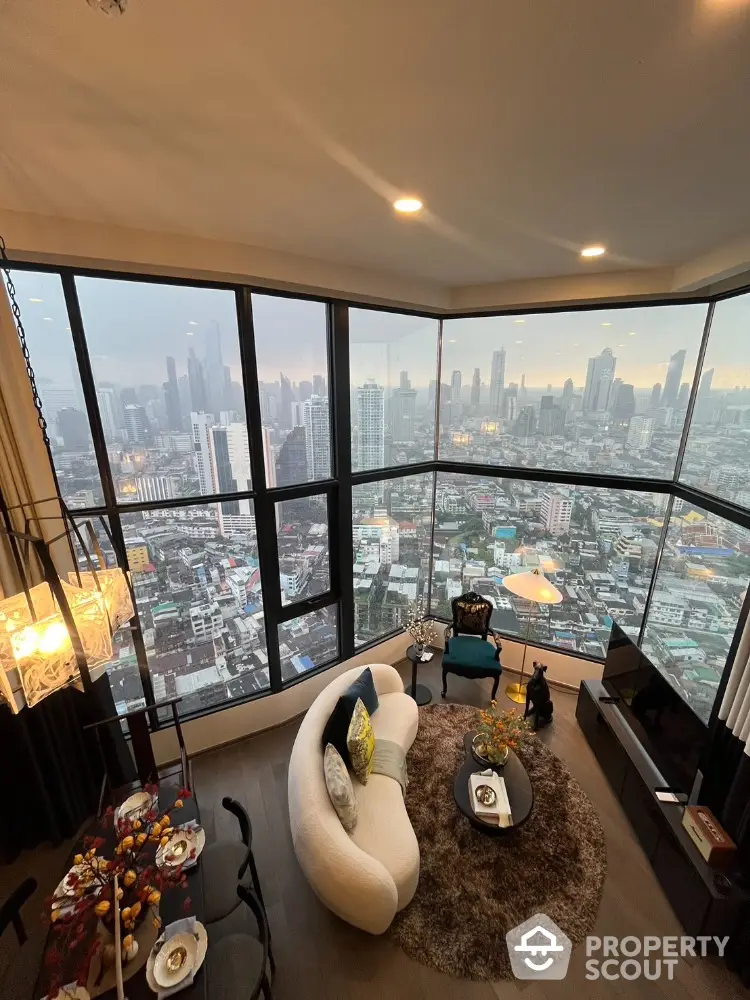 Luxurious corner unit living room with panoramic city view and modern decor