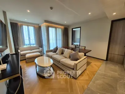 Luxurious living room with elegant furniture and large windows offering natural light.
