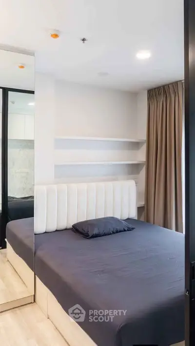 Modern bedroom with stylish decor and ample natural light
