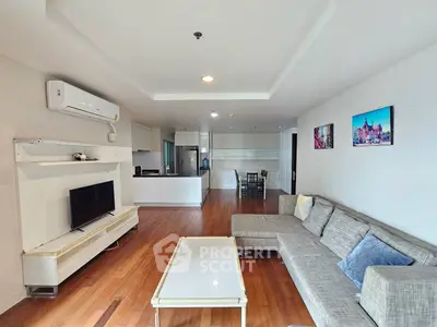 Spacious modern living room with open kitchen and stylish decor