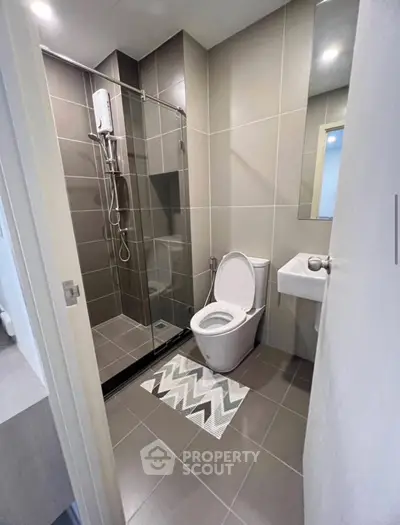 Modern bathroom with sleek glass shower and contemporary fixtures
