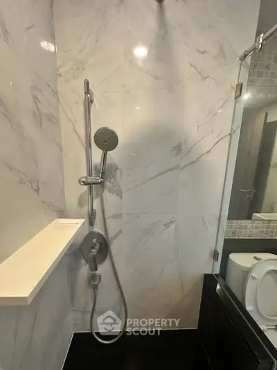 Modern bathroom with sleek shower and marble tiles